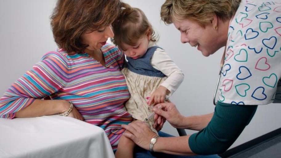 toddler getting a shot